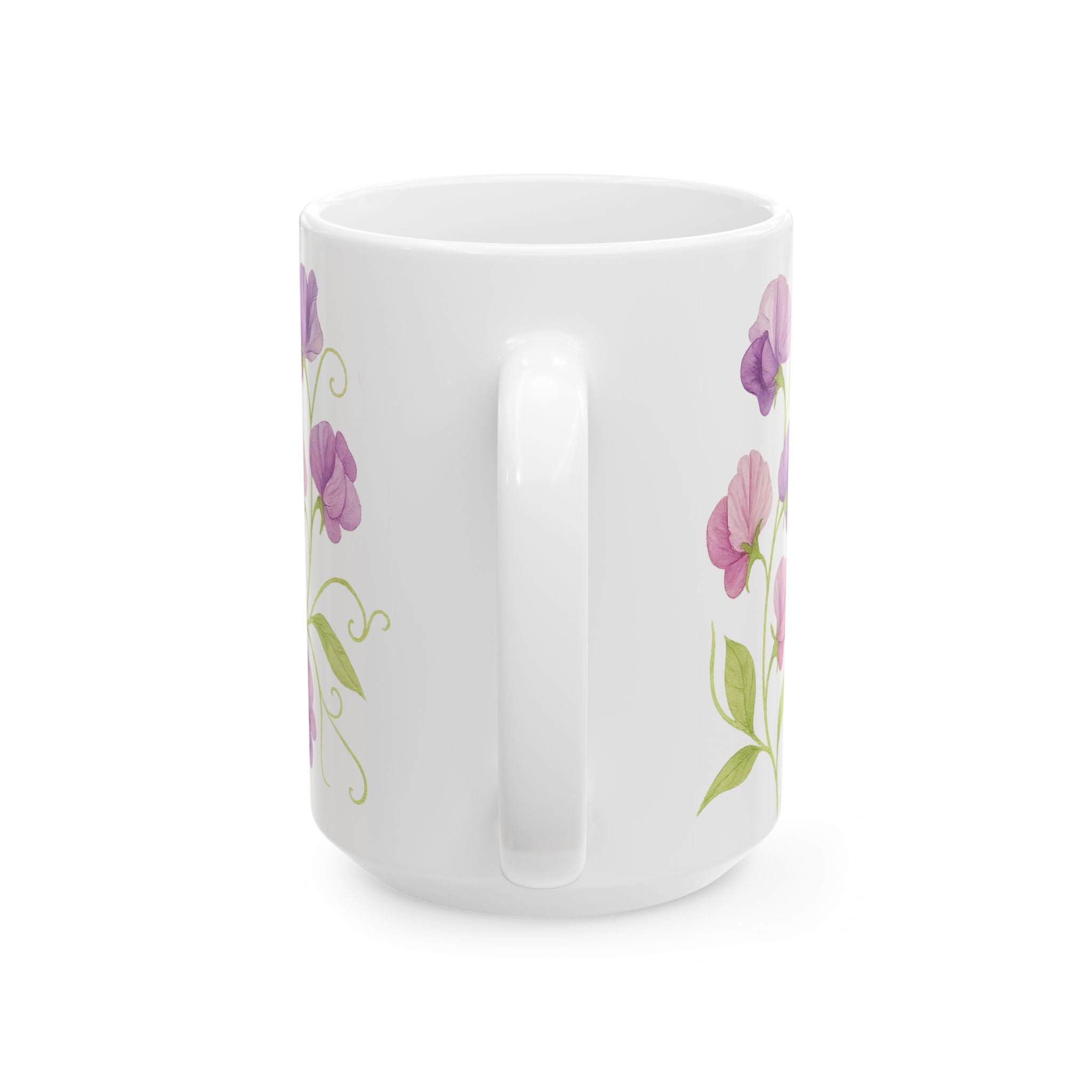 White mug with sweet pea floral designs on a white background