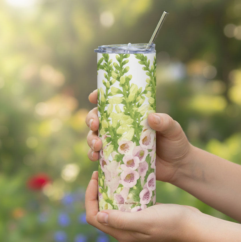 Foxglove flower tumbler in the hands of a gardener.